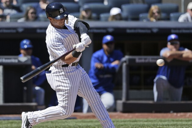 New York Yankees' Gleyber Torres hits into a double play during the fourth inning of a baseball game against the Toronto Blue Jays at Yankee Stadium, Sunday, April 22, 2018, in New York. (AP Photo/Seth Wenig)
