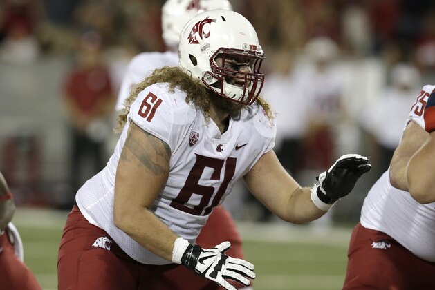 Washington State offensive lineman Cole Madison (61) in the first half during an NCAA college football game against Arizona, Saturday, Oct. 28, 2017, in Tucson, Ariz. (AP Photo/Rick Scuteri)
