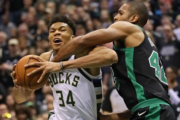 MILWAUKEE, WI - APRIL 22:    Giannis Antetokounmpo #34 of the Milwaukee Bucks drives against Al Horford #42 of the Boston Celtics during Game Four of Round One of the 2018 NBA Playoffs at the Bradley Center on April 22, 2018 in Milwaukee, Wisconsin. The Bucks defeated the Celtics 104-102. NOTE TO USER: User expressly acknowledges and agrees that, by downloading and or using this photograph, User is consenting to the terms and conditions of the Getty Images License Agreement. (Photo by Jonathan Daniel/Getty Images)