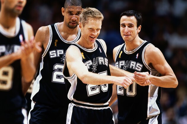 EAST RUTHERFORD, NJ - JUNE 13:  Steve Kerr #25 of the San Antonio Spurs celebrates with teammate Emanuel Ginobili #20 during Game five of the NBA Finals at Continental Airlines Arena on June 13, 2003 in East Rutherford, New Jersey.  The Spurs won 93-83.  NOTE TO USER: User expressly acknowledges and agrees that, by downloading and/or using this Photograph, User is consenting to the terms and conditions of the Getty Images License Agreement  Copyright 2003 NBAE  (Photo by Nathaniel S. Butler/NBAEvia Getty Images)
