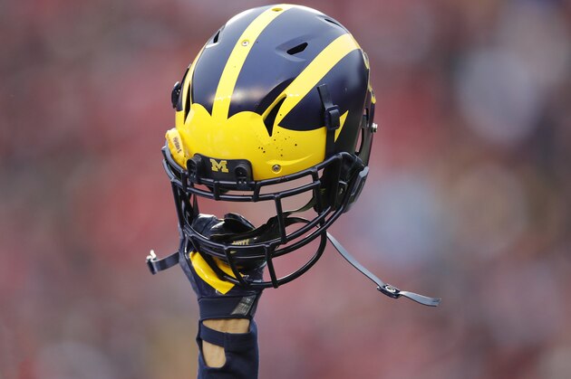 MADISON, WI - NOVEMBER 18: General view as a Michigan Wolverines helmet is held in the air during a game against the Wisconsin Badgers at Camp Randall Stadium on November 18, 2017 in Madison, Wisconsin. Wisconsin won 24-10. (Photo by Joe Robbins/Getty Images) *** Local Caption ***