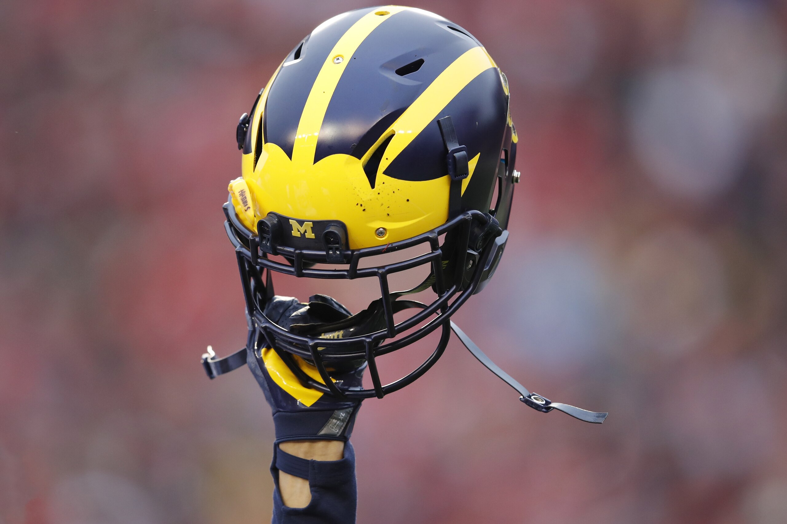 MADISON, WI - NOVEMBER 18: General view as a Michigan Wolverines helmet is held in the air during a game against the Wisconsin Badgers at Camp Randall Stadium on November 18, 2017 in Madison, Wisconsin. Wisconsin won 24-10. (Photo by Joe Robbins/Getty Images) *** Local Caption ***