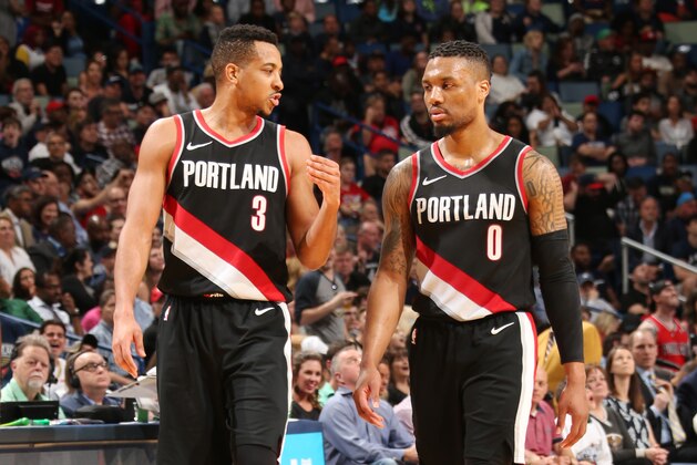 NEW ORLEANS, LA - MARCH 27:  CJ McCollum #3 and Damian Lillard #0 of the Portland Trail Blazers look on during the game against the New Orleans Pelicans on March 27, 2018 at the Smoothie King Center in New Orleans, Louisiana. NOTE TO USER: User expressly acknowledges and agrees that, by downloading and or using this Photograph, user is consenting to the terms and conditions of the Getty Images License Agreement. Mandatory Copyright Notice: Copyright 2018 NBAE (Photo by Layne Murdoch/NBAE via Getty Images)