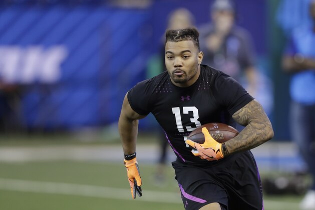 LSU running back Derrius Guice runs a drill during the NFL football scouting combine, Friday, March 2, 2018, in Indianapolis. (AP Photo/Darron Cummings)
