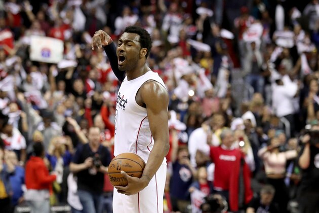 WASHINGTON, DC - APRIL 22: John Wall #2 of the Washington Wizards celebrates in the closing minute of the Wizards 106-98 win over the Toronto Raptors during Game Four of Round One of the 2018 NBA Playoffs at Capital One Arena on April 22, 2018 in Washington, DC. NOTE TO USER: User expressly acknowledges and agrees that, by downloading and or using this photograph, User is consenting to the terms and conditions of the Getty Images License Agreement. (Photo by Rob Carr/Getty Images)