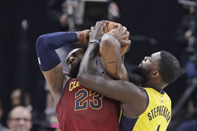 Cleveland Cavaliers' LeBron James (23) is tied up by Indiana Pacers' Lance Stephenson during the second half of Game 4 of a first-round NBA basketball playoff series, Sunday, April 22, 2018, in Indianapolis. Cleveland won 104-100. (AP Photo/Darron Cummings)