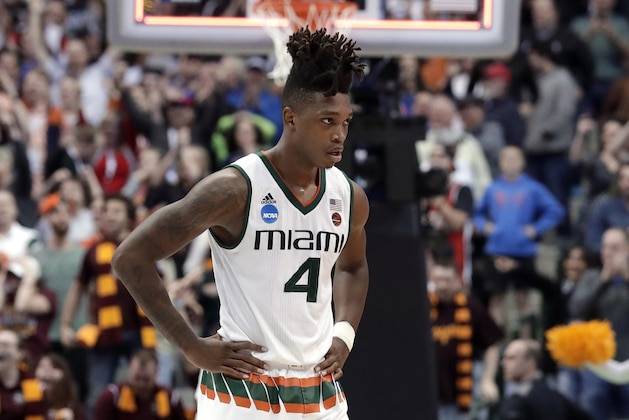 Miami's Lonnie Walker IV (4) walks off the court after their 64-62 loss to Loyola-Chicago in a first-round game at the NCAA college basketball tournament in Dallas, Thursday, March 15, 2018. (AP Photo/Tony Gutierrez)