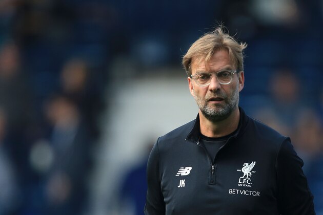 Liverpool's German manager Jurgen Klopp watches his players warm-up before kick off of the English Premier League football match between West Bromwich Albion and Liverpool at The Hawthorns stadium in West Bromwich, central England, on April 21, 2018. (Photo by Lindsey PARNABY / AFP) / RESTRICTED TO EDITORIAL USE. No use with unauthorized audio, video, data, fixture lists, club/league logos or 'live' services. Online in-match use limited to 75 images, no video emulation. No use in betting, games or single club/league/player publications. /         (Photo credit should read LINDSEY PARNABY/AFP/Getty Images)
