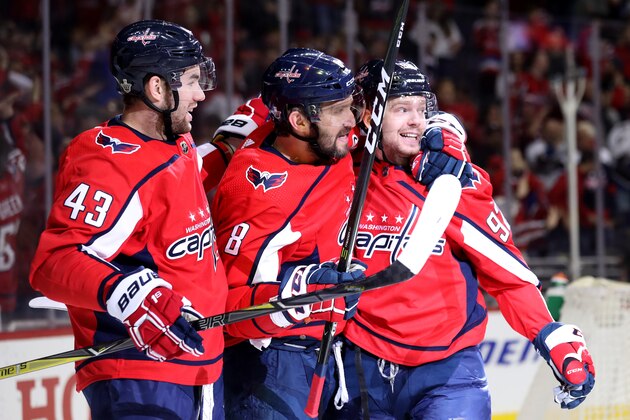 WASHINGTON, DC - APRIL 21: Evgeny Kuznetsov #92 of the Washington Capitals celebrates with Alex Ovechkin #8  and Tom Wilson #43 after scoring a second period goal Columbus Blue Jackets during Game Five of the Eastern Conference First Round during the 2018 NHL Stanley Cup Playoffs at Capital One Arena on April 21, 2018 in Washington, DC. (Photo by Rob Carr/Getty Images)