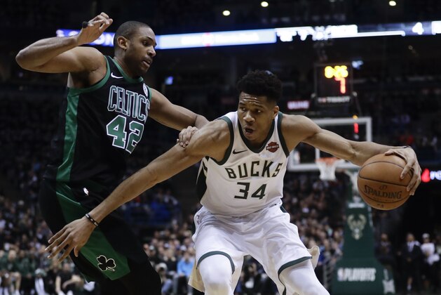 Milwaukee Bucks' Giannis Antetokounmpo tries to drive past Boston Celtics' Al Horford during the first half of Game 4 of an NBA basketball first-round playoff series Sunday, April 22, 2018, in Milwaukee. (AP Photo/Morry Gash)