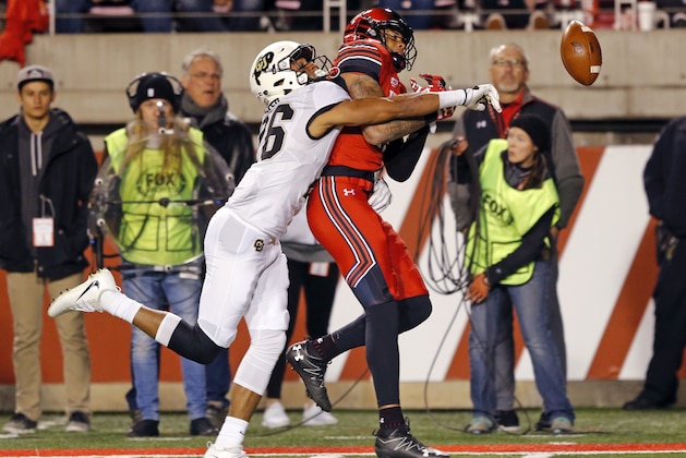 Colorado defensive back Isaiah Oliver (26) breaks up the pass to Utah wide receiver Raelon Singleton, right, in the first half during an NCAA college football game Saturday, Nov. 25, 2017, in Salt Lake City. (AP Photo/Rick Bowmer)