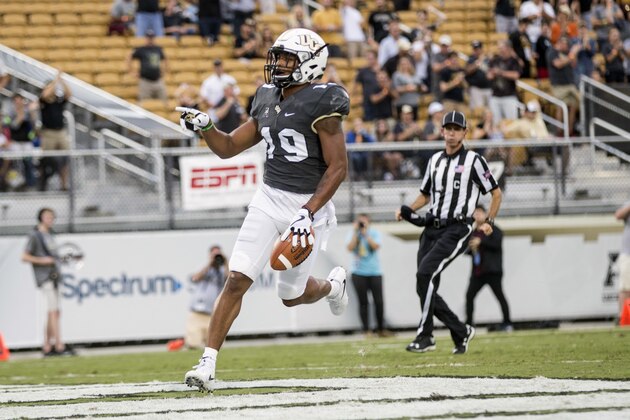Central Florida's Mike Hughes (19) scores a touchdown on a kickoff return during the first half of an NCAA college football game against Austin Peay, Saturday, Oct. 28, 2017, in Orlando, Fla. (AP Photo/Willie J. Allen Jr.)