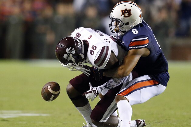 File-This Sept. 30, 2017, file photo shows Auburn defensive back Carlton Davis (6) breaking up a pass intended for Mississippi State wide receiver Jesse Jackson (86) during the second half of an NCAA college football game, in Auburn, Ala. Davis was selected to the AP All-America team announced Monday, Dec. 11, 2017. (AP Photo/Butch Dill, File) File-This Sept. 30, 2017, file photo shows Auburn defensive back Carlton Davis (6) breaking up a pass intended for Mississippi State wide receiver Jesse Jackson (86) during the second half of an NCAA college football game, in Auburn, Ala. Davis was selected to the AP All-America team announced Monday, Dec. 11, 2017. (AP Photo/Butch Dill, File)