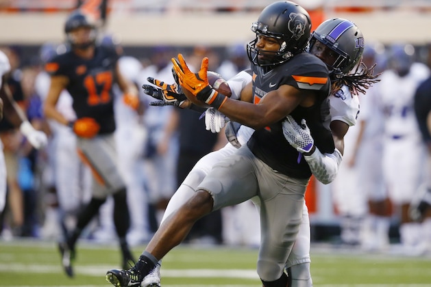 Central Arkansas cornerback Tremon Smith, rear, breaks up a pass intended for Oklahoma State wide receiver Brandon Sheperd (7) in the second quarter of an NCAA college football game in Stillwater, Okla., Saturday, Sept. 12, 2015. (AP Photo/Sue Ogrocki)