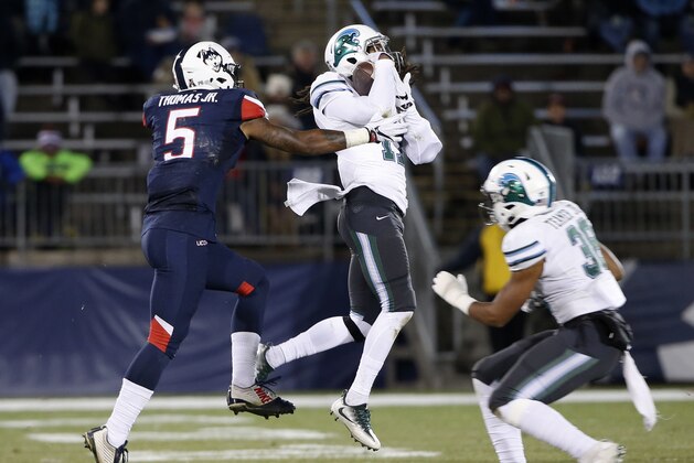 Tulane cornerback Parry Nickerson (17) intercepts a pass intended for Connecticut wide receiver Noel Thomas (5) during the first half of an NCAA college football game in East Hartford, Conn., Saturday, Nov. 26, 2016. (AP Photo/Mary Schwalm)