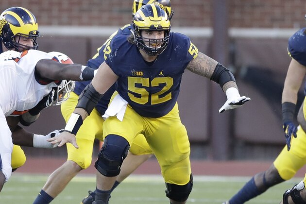 Michigan offensive lineman Mason Cole (52) defends the line during the second half of an NCAA college football game against Illinois, Saturday, Oct. 22, 2016 in Ann Arbor, Mich. (AP Photo/Carlos Osorio)