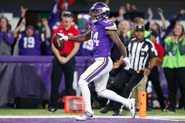 MINNEAPOLIS, MN - JANUARY 14:  Stefon Diggs #14 of the Minnesota Vikings scores a touchdown as time expires against the New Orleans Saints during the second half of the NFC Divisional Playoff game at U.S. Bank Stadium on January 14, 2018 in Minneapolis, Minnesota.  (Photo by Jamie Squire/Getty Images)