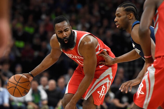 MINNEAPOLIS, MN - APRIL 23: James Harden #13 of the Houston Rockets dribbles the ball against Andrew Wiggins #22 of the Minnesota Timberwolves during the first quarter in Game Four of Round One of the 2018 NBA Playoffs on April 23, 2018 at the Target Center in Minneapolis, Minnesota. NOTE TO USER: User expressly acknowledges and agrees that, by downloading and or using this Photograph, user is consenting to the terms and conditions of the Getty Images License Agreement. (Photo by Hannah Foslien/Getty Images)