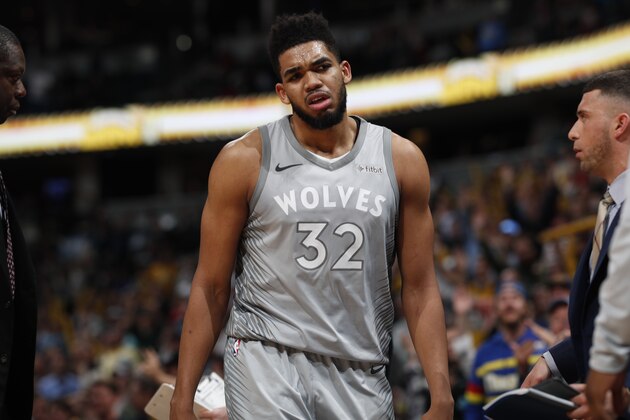 Minnesota Timberwolves center Karl-Anthony Towns (32) in the second half of an NBA basketball game Thursday, April 5, 2018, in Denver. The Nuggets won 100-96. (AP Photo/David Zalubowski)
