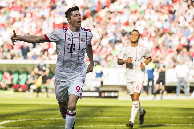 Bayern Munich's Polish forward Robert Lewandowski celebrates scoring his teams second goal during the German first division Bundesliga football match between Hannover 96 vs Bayern Munich in Hanover, central Germany, on April 21, 2018. (Photo by Odd ANDERSEN / AFP) / RESTRICTIONS: DURING MATCH TIME: DFL RULES TO LIMIT THE ONLINE USAGE TO 15 PICTURES PER MATCH AND FORBID IMAGE SEQUENCES TO SIMULATE VIDEO. == RESTRICTED TO EDITORIAL USE == FOR FURTHER QUERIES PLEASE CONTACT DFL DIRECTLY AT + 49 69 650050        (Photo credit should read ODD ANDERSEN/AFP/Getty Images)