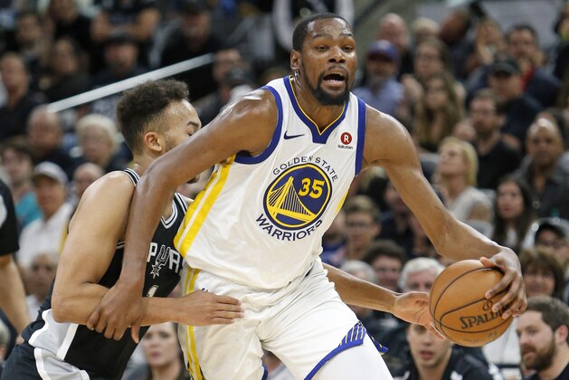 SAN ANTONIO,TX - APRIL 22 :  Kyle Anderson #1 of the San Antonio Spurs fouls Kevin Durant #35 of the Golden State Warriors in the second half of Game Four of Round One of the 2018 NBA Playoffs  at AT&T Center on April 22 , 2018  in San Antonio, Texas.  NOTE TO USER: User expressly acknowledges and agrees that , by downloading and or using this photograph, User is consenting to the terms and conditions of the Getty Images License Agreement. (Photo by Ronald Cortes/Getty Images)