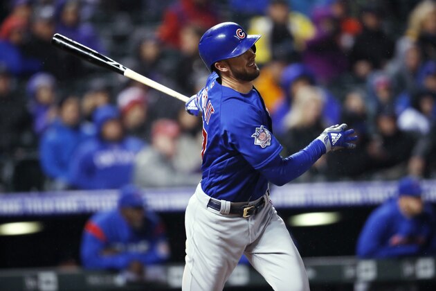 Chicago Cubs' Kris Bryant watches his double off Colorado Rockies relief pitcher Bryan Shaw during the sixth inning of a baseball game Friday, April 20, 2018, in Denver. The Cubs won 16-5. (AP Photo/David Zalubowski)