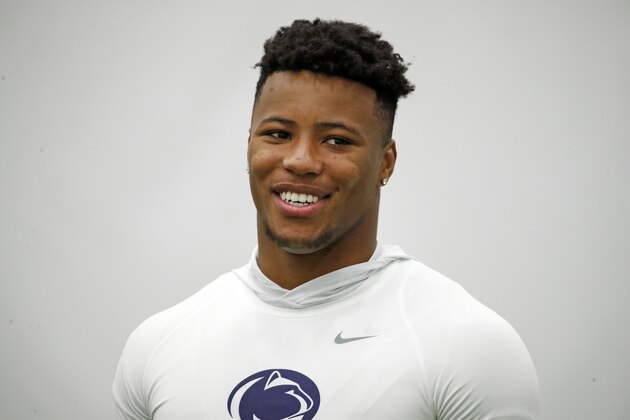 Penn State running back Saquon Barkley waits to be interviewed during Penn State Pro Day in State College, Pa., Tuesday, March 20, 2018. Barkley did not participate in the drills. (AP Photo/Gene J. Puskar)