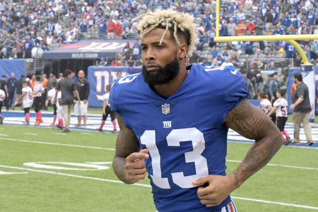 FILE - In this Oct. 8, 2017, file photo, New York Giants wide receiver Odell Beckham warms up prior to an NFL football game against the Los Angeles Chargers, in East Rutherford, N.J.  The Giants have opened their first organized team activities under new coach Pat Shurmur with star receiver Odell Beckham Jr. in the building. Talking on a conference call Monday morning, April 9, 2018, Shurmur says he hasn't spoken with Beckham, whose name has been prominent in trade speculation in recent months. (AP Photo/Bill Kostroun, File)