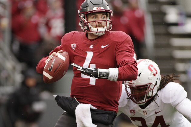 Washington State quarterback Luke Falk (4) looks for a receiver as Stanford linebacker Peter Kalambayi (34) approaches during the second half of an NCAA college football game in Pullman, Wash., Saturday, Nov. 4, 2017. (AP Photo/Young Kwak)