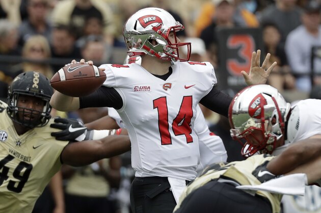 Western Kentucky quarterback Mike White (14) plays against Vanderbilt in the first half of an NCAA college football game Saturday, Nov. 4, 2017, in Nashville, Tenn. (AP Photo/Mark Humphrey)
