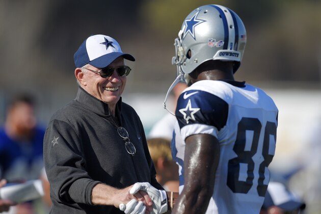 Dallas Cowboys owner Jerry Jones, left, talks with wide receiver Dez Bryant during a joint NFL football training camp with the St. Louis Rams, Tuesday, Aug. 18, 2015, in Oxnard, Calif. (AP Photo/Mark J. Terrill)