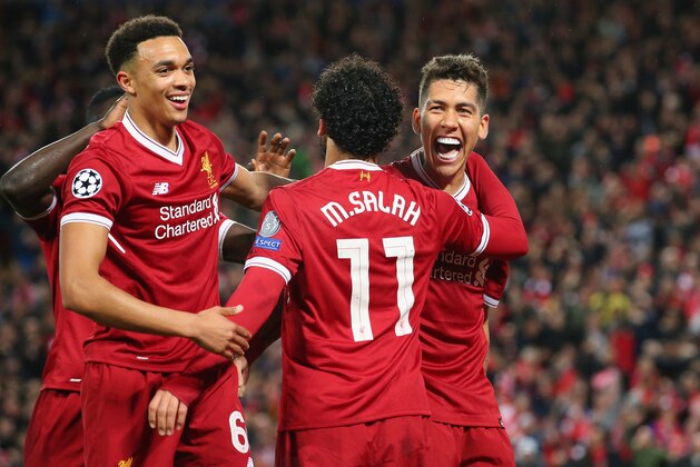 LIVERPOOL, ENGLAND - APRIL 24:  Roberto Firmino of Liverpool celebrates with Mohamed Salah after scoring their fourth goal during the UEFA Champions League Semi Final First Leg match between Liverpool and A.S. Roma at Anfield on April 24, 2018 in Liverpool, United Kingdom.  (Photo by Alex Livesey - Danehouse/Getty Images)