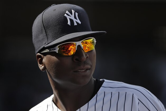New York Yankees shortstop Didi Gregorius (18) waits for teammates to come off the field at the end of the top of the seventh inning of a baseball game against the Baltimore Orioles, Saturday, April 7, 2018, in New York. (AP Photo/Julie Jacobson)