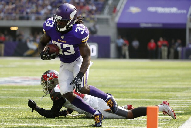 Minnesota Vikings running back Dalvin Cook (33) runs from Tampa Bay Buccaneers cornerback Vernon Hargreaves, rear, during the first half of an NFL football game, Sunday, Sept. 24, 2017, in Minneapolis. (AP Photo/Bruce Kluckhohn)