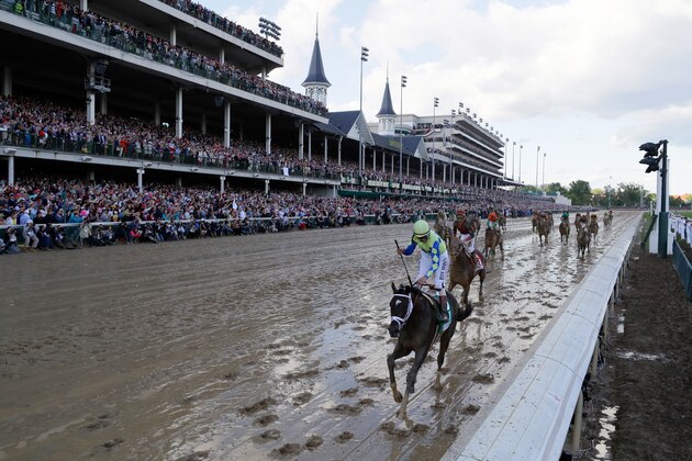 LOUISVILLE, KY - MAY 06:  Jockey John Velazquez celebrates as he guides Always Dreaming #5 across the finish line to win the 143rd running of the Kentucky Derby at Churchill Downs on May 6, 2017 in Louisville, Kentucky.  (Photo by Jamie Squire/Getty Images)