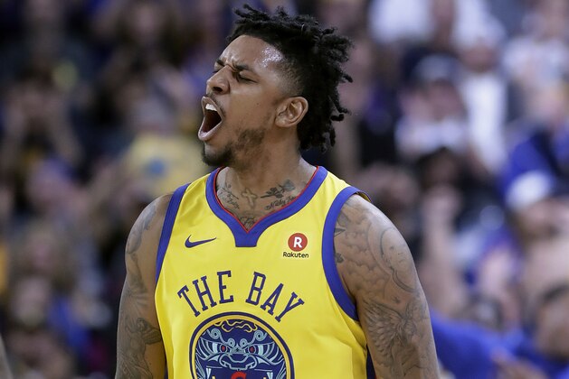 Golden State Warriors guard Nick Young celebrates after scoring during the second half of the team's NBA basketball game against the San Antonio Spurs in Oakland, Calif., Thursday, March 8, 2018. (AP Photo/Jeff Chiu)