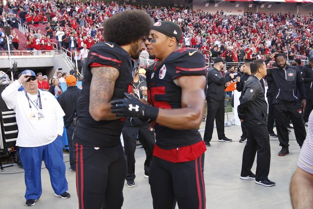 SANTA CLARA, CA - OCTOBER 6: Colin Kaepernick #7 and Eric Reid #35 of the San Francisco 49ers embrace on the sideline, following the anthem, prior to the game against the Arizona Cardinals at Levi Stadium on October 6, 2016 in Santa Clara, California. The Cardinals defeated the 49ers 33-21. (Photo by Michael Zagaris/San Francisco 49ers/Getty Images)