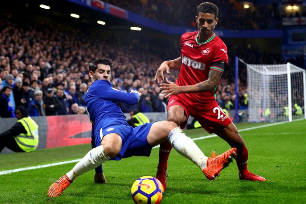 LONDON, ENGLAND - NOVEMBER 29:  Kyle Naughton of Swansea City challenges Alvaro Morata of Chelsea during the Premier League match between Chelsea and Swansea City at Stamford Bridge on November 29, 2017 in London, England.  (Photo by Clive Rose/Getty Images)