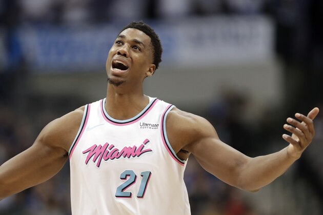 Miami Heat's Hassan Whiteside (21) throws his arms up after his team was charged a foul in the second half of an NBA basketball game against the Dallas Mavericks on Monday, Jan. 29, 2018, in Dallas. (AP Photo/Tony Gutierrez)