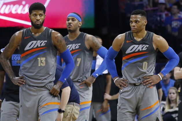 Oklahoma City Thunder forward Paul George (13), forward Carmelo Anthony and guard Russell Westbrook (0) are pictured in the second half of an NBA basketball game against the New Orleans Pelicans in Oklahoma City, Friday, Feb. 2, 2018. (AP Photo/Sue Ogrocki)