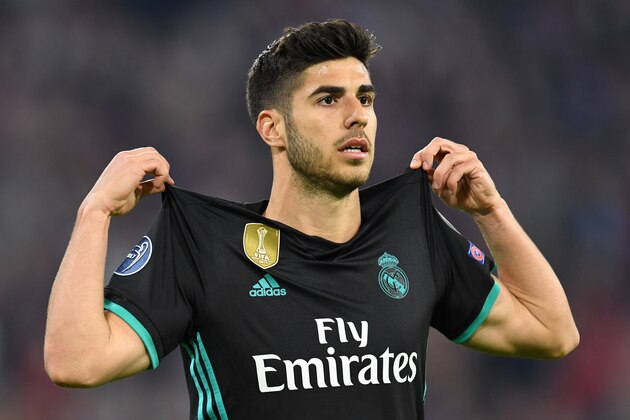 Real Madrid's Spanish midfielder Marco Asensio celebrates after scoring a goal during the UEFA Champions League semi-final first-leg football match FC Bayern Munich v Real Madrid CF in Munich in southern Germany on April 25, 2018. (Photo by Christof STACHE / AFP)        (Photo credit should read CHRISTOF STACHE/AFP/Getty Images)
