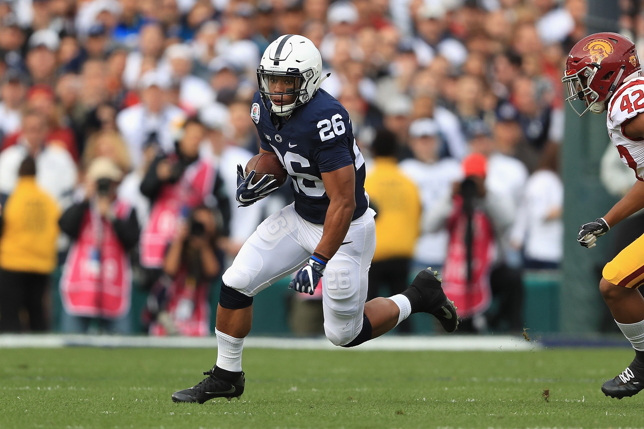 PASADENA, CA - JANUARY 02: Running back Saquon Barkley #26 of the Penn State Nittany Lions runs with the ball against the USC Trojans during the 2017 Rose Bowl Game presented by Northwestern Mutual at the Rose Bowl on January 2, 2017 in Pasadena, California. (Photo by Sean M. Haffey/Getty Images) PASADENA, CA - JANUARY 02: Running back Saquon Barkley #26 of the Penn State Nittany Lions runs with the ball against the USC Trojans during the 2017 Rose Bowl Game presented by Northwestern Mutual at the Rose Bowl on January 2, 2017 in Pasadena, California. (Photo by Sean M. Haffey/Getty Images)