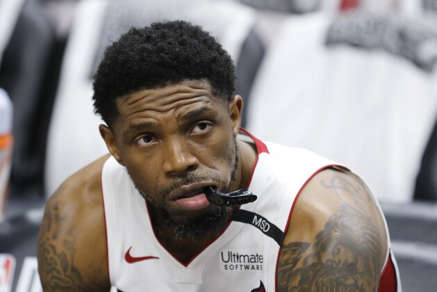 Miami Heat forward Udonis Haslem (40) watches warmups from the bench before play against the Philadelphia 76ers in Game 4 of a first-round NBA basketball playoff series, Saturday, April 21, 2018, in Miami. (AP Photo/Joe Skipper)