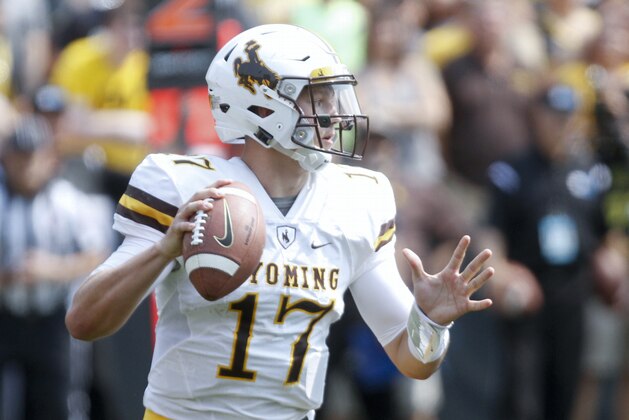 IOWA CITY, IOWA- SEPTEMBER 2:  Quarterback Josh Allen #17 of the Wyoming Cowboys looks for a receiver in the third quarter against the Iowa Hawkeyes, on September 2, 2017 at Kinnick Stadium in Iowa City, Iowa.  (Photo by Matthew Holst/Getty Images)
