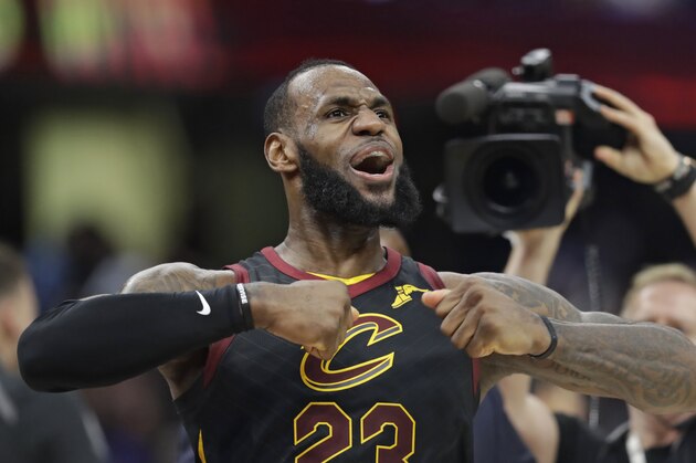 Cleveland Cavaliers' LeBron James celebrates after scoring the game-winning shot in the second half of Game 5 of an NBA basketball first-round playoff series against the Indiana Pacers, Wednesday, April 25, 2018, in Cleveland. The Cavaliers won 98-95. (AP Photo/Tony Dejak)