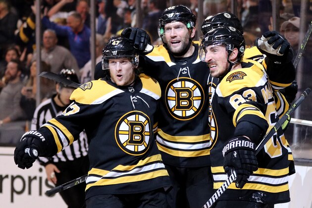 BOSTON, MA - APRIL 25: Torey Krug #47 of the Boston Bruins, David Backes #42 and Brad Marchand #63 celebrate with Patrice Bergeron #37 after he scored a goal against the Toronto Maple Leafs during the first period of Game Seven of the Eastern Conference First Round in the 2018 Stanley Cup play-offs at TD Garden on April 25, 2018 in Boston, Massachusetts. (Photo by Maddie Meyer/Getty Images)