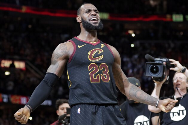 Cleveland Cavaliers' LeBron James reacts after making the game-winning shot in the second half of Game 5 of an NBA basketball first-round playoff series against the Indiana Pacers, Wednesday, April 25, 2018, in Cleveland. The Cavaliers won 98-95. (AP Photo/Tony Dejak)