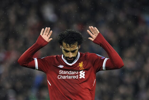 Liverpool's Mohamed Salah celebrates after scoring his side's second goal during the Champions League semifinal, first leg, soccer match between Liverpool and Roma at Anfield Stadium, Liverpool, England, Tuesday, April 24, 2018. (AP Photo/Rui Vieira)