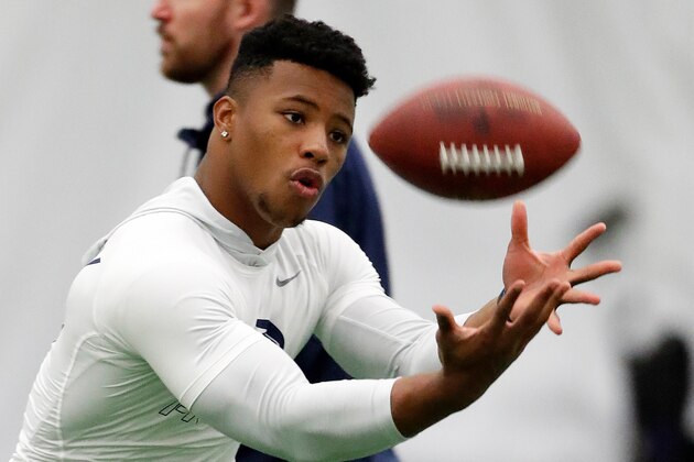 File-This March 20, 2018, file photo shows running back Saquon Barkley catching a football during Penn State NFL football Pro Day in State College, Pa. Barkley is the best player in this year's draft. Yet he might not go in the first handful of picks Thursday night. Huh? Blame the desperation to find quarterbacks in great part for the possibility that the Penn State All-America running back could fall well below where his talent, character and versatility warrant. (AP Photo/Gene J. Puskar, File)