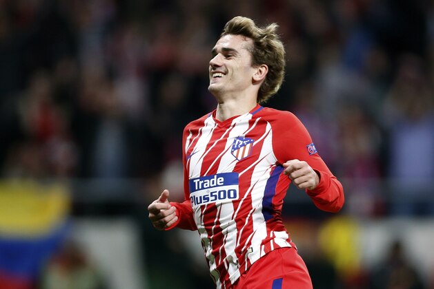 Atletico's Antoine Griezmann celebrates after scoring his side's second goal during the Europa League quarterfinal first leg soccer match between Atletico Madrid and Sporting CP at the Metropolitano stadium in Madrid, Thursday, April 5, 2018. (AP Photo/Francisco Seco)